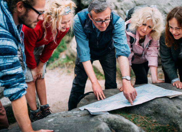 Group of Hikers checking route on map